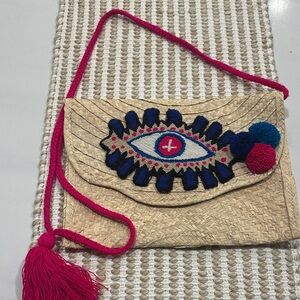 Handcrafted Straw Clutch with Eye Design
